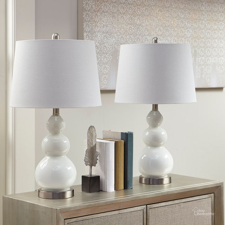 The appearance of Covey Table Lamp Set Of 2 In White designed by Olliix in the transitional interior design. This white piece of furniture  was selected by 1StopBedrooms from Covey Collection to add a touch of cosiness and style into your home. Sku: 5DS153-0008. Material: Metal. Product Type: Table Lamp. Image1