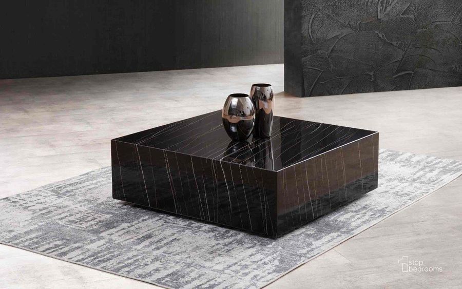 The appearance of Cube Black Marble Coffee Table designed by Whiteline Modern Living in the modern / contemporary interior design. This high gloss black piece of furniture  was selected by 1StopBedrooms from Cube Collection to add a touch of cosiness and style into your home. Sku: CT1667-BLK. Material: Marble. Product Type: Coffee Table. Image1