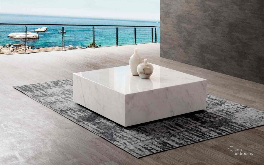 The appearance of Cube White Marble Coffee Table designed by Whiteline Modern Living in the modern / contemporary interior design. This white piece of furniture  was selected by 1StopBedrooms from Cube Collection to add a touch of cosiness and style into your home. Sku: CT1667-WHT. Material: Marble. Product Type: Coffee Table. Image1
