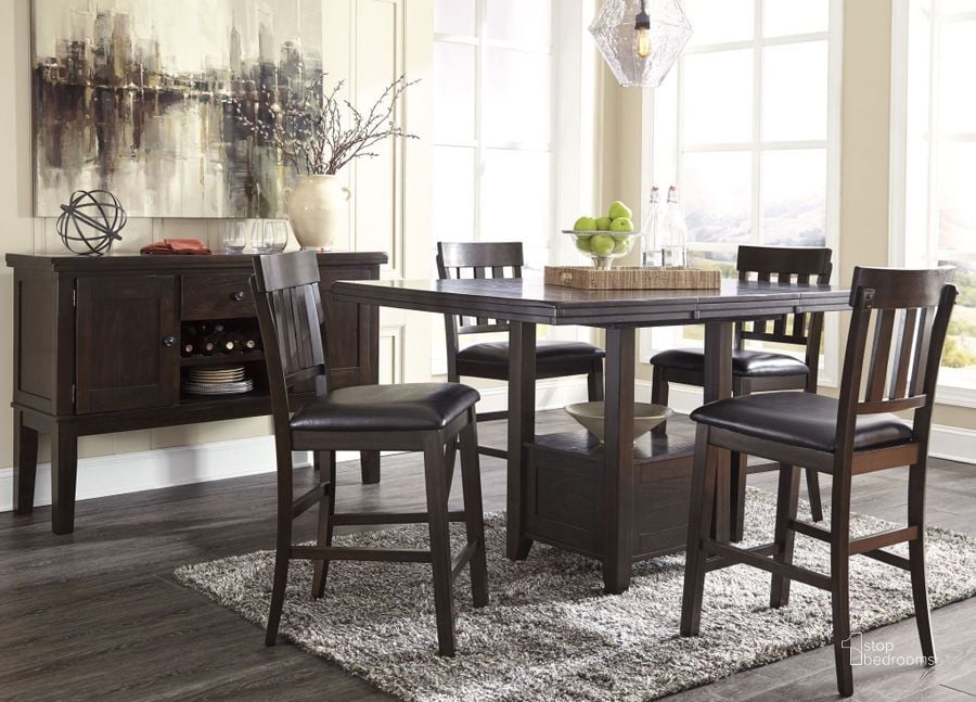 The appearance of Haddigan Dark Brown Rectangular Extendable Counter Height Dining Room Set designed by Signature Design by Ashley in the transitional interior design. This dark brown piece of furniture  was selected by 1StopBedrooms from Haddigan Collection to add a touch of cosiness and style into your home. Sku: D596-42;D596-124. Material: Wood. Product Type: Dining Room Set. Table Top Shape: Rectangular. Image1
