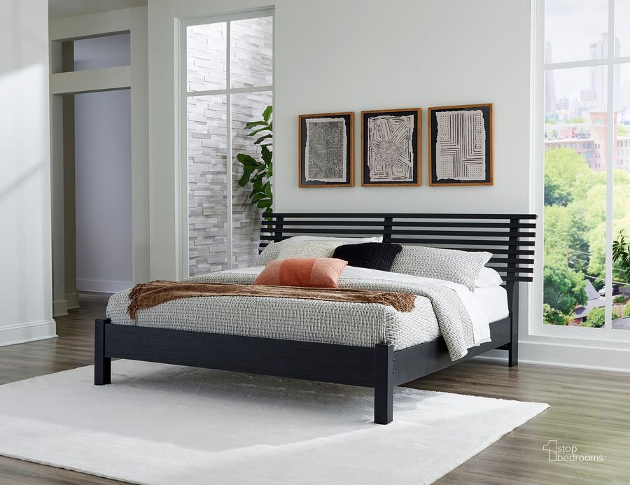 The appearance of Danziar King Slat Panel Bed In Black designed by Signature Design by Ashley in the modern / contemporary interior design. This black piece of furniture  was selected by 1StopBedrooms from Danziar Collection to add a touch of cosiness and style into your home. Sku: B100-14;B1013-156;B1013-158. Bed Type: Panel Bed. Material: Wood. Product Type: Panel Bed. Bed Size: King. Image1