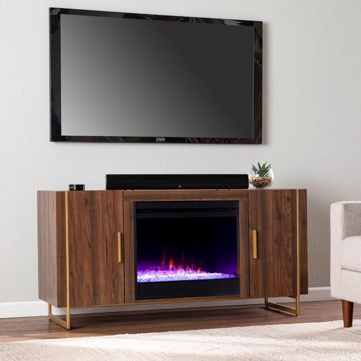 The appearance of Dashton Color Changing Fireplace With Media Storage designed by SEI Furniture in the modern / contemporary interior design. This brown and gold piece of furniture  was selected by 1StopBedrooms from Dashton Collection to add a touch of cosiness and style into your home. Sku: FC1138156. Material: Wood. Product Type: Fireplace. Image1