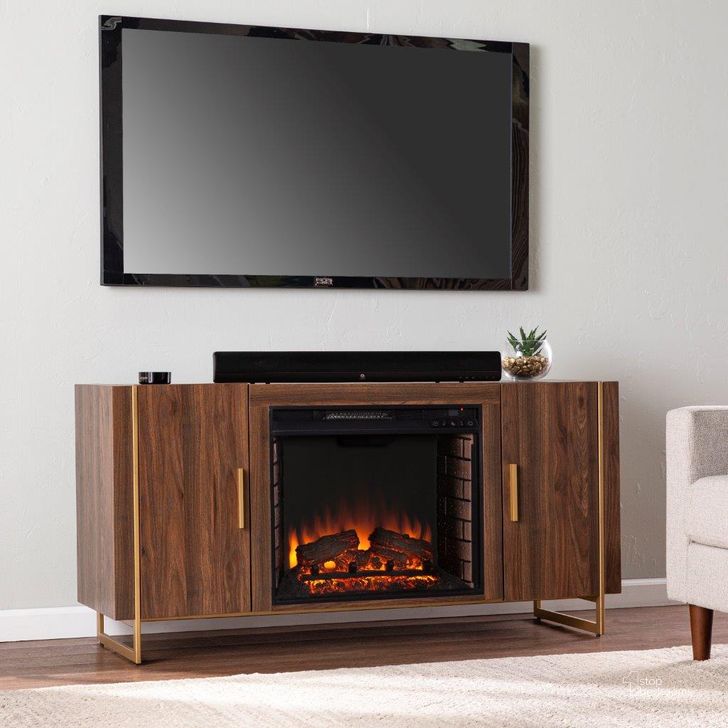 The appearance of Dashton Electric Fireplace With Media Storage designed by SEI Furniture in the modern / contemporary interior design. This brown and gold piece of furniture  was selected by 1StopBedrooms from Dashton Collection to add a touch of cosiness and style into your home. Sku: FE1138156. Material: Wood. Product Type: Fireplace. Image1