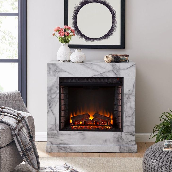 The appearance of Dendale Faux Marble Fireplace In White FE1062859 designed by SEI Furniture in the modern / contemporary interior design. This white piece of furniture  was selected by 1StopBedrooms from Dendale Collection to add a touch of cosiness and style into your home. Sku: FE1062859. Material: Wood. Product Type: Fireplace. Image1