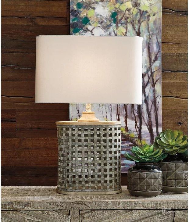 The appearance of Deondra Gray Table Lamp designed by Signature Design by Ashley in the transitional interior design. This gray piece of furniture  was selected by 1StopBedrooms from Deondra Collection to add a touch of cosiness and style into your home. Sku: L208234. Material: Metal. Product Type: Table Lamp. Image1