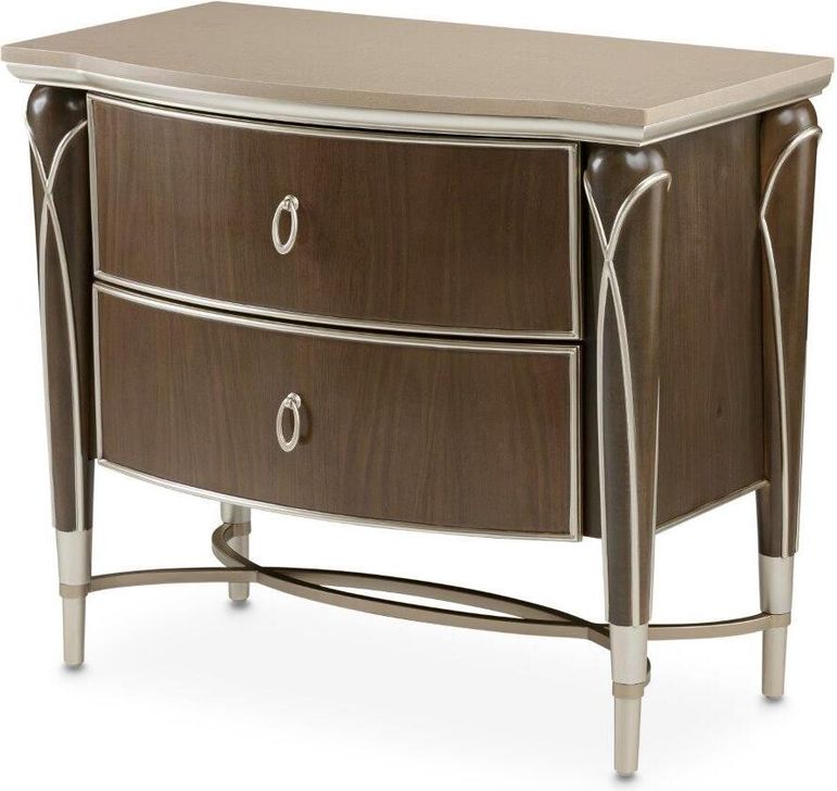 The appearance of Devany Hazelnut Nightstand designed by Off 5th Home in the transitional interior design. This hazelnut piece of furniture  was selected by 1StopBedrooms from Devany Collection to add a touch of cosiness and style into your home. Sku: N9008040-410. Material: Marble. Product Type: Nightstand. Image1