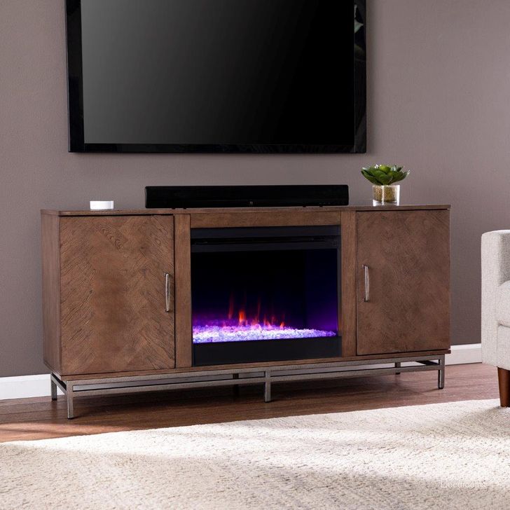 The appearance of Dibbonly Color Changing Fireplace With Media Storage designed by SEI Furniture in the transitional interior design. This brown piece of furniture  was selected by 1StopBedrooms from Dibbonly Collection to add a touch of cosiness and style into your home. Sku: FC1095756. Material: Wood. Product Type: Fireplace. Image1