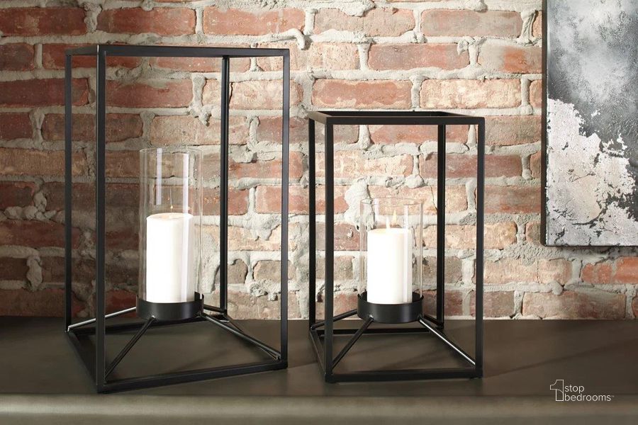 The appearance of Dimtrois Black Lantern Set of 2 designed by Signature Design by Ashley in the transitional interior design. This black piece of furniture  was selected by 1StopBedrooms from Dimtrois Collection to add a touch of cosiness and style into your home. Sku: A2000133. Material: Glass. Product Type: Lantern. Image1