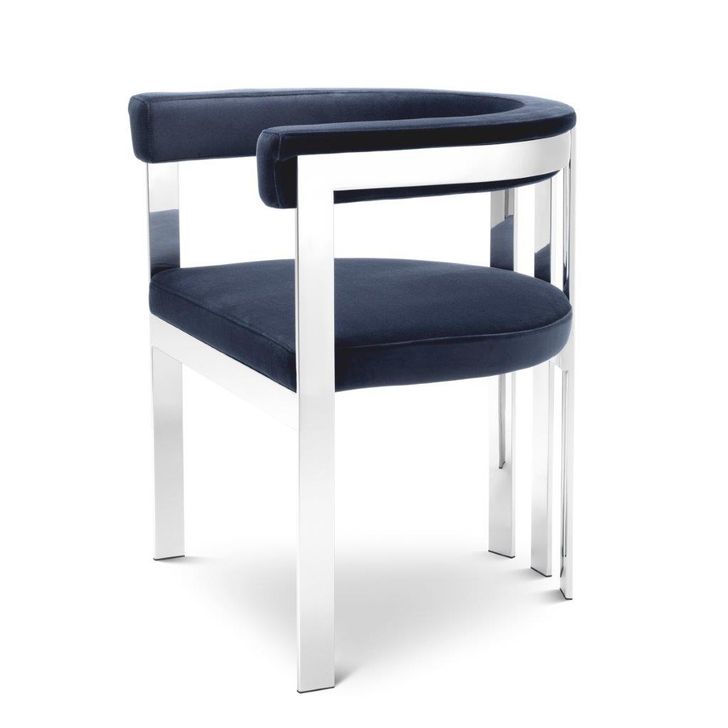 The appearance of Dining Chair Clubhouse In Savona Midnight Blue designed by Eichholtz in the modern / contemporary interior design. This blue piece of furniture  was selected by 1StopBedrooms from Clubhouse Collection to add a touch of cosiness and style into your home. Sku: A112299. Product Type: Dining Chair. Material: Stainless Steel. Image1