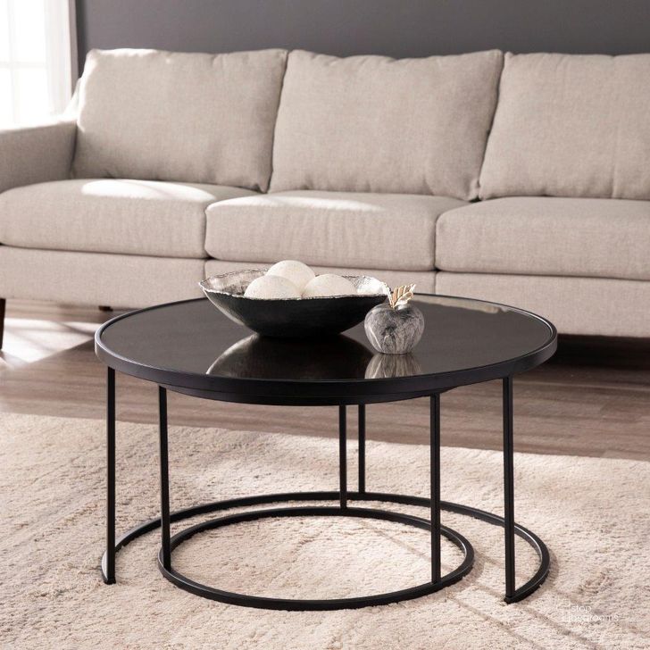 The appearance of Downham Round Nesting Cocktail Tables Set of 2 designed by SEI Furniture in the modern / contemporary interior design. This black piece of furniture  was selected by 1StopBedrooms from Downham Collection to add a touch of cosiness and style into your home. Sku: CK1024704. Product Type: Cocktail Table. Material: Iron. Image1