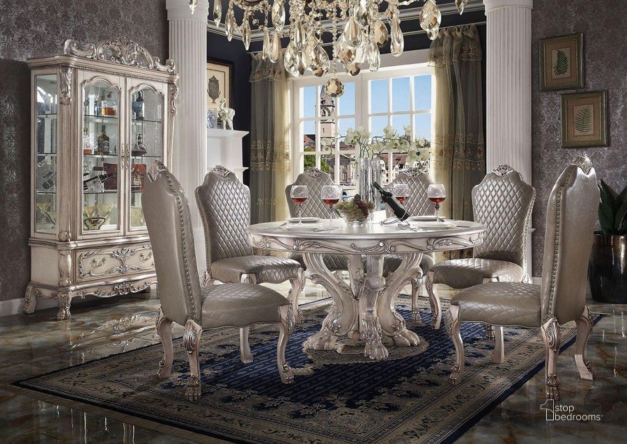 The appearance of Dresden Round Dining Room Set (Vintage Bone White) designed by ACME in the transitional interior design. This bone white piece of furniture  was selected by 1StopBedrooms from Dresden Collection to add a touch of cosiness and style into your home. Sku: 68180T;68181ST;68172. Table Base Style: Pedestal. Table Top Shape: Round. Material: Wood. Product Type: Dining Room Set. Image1