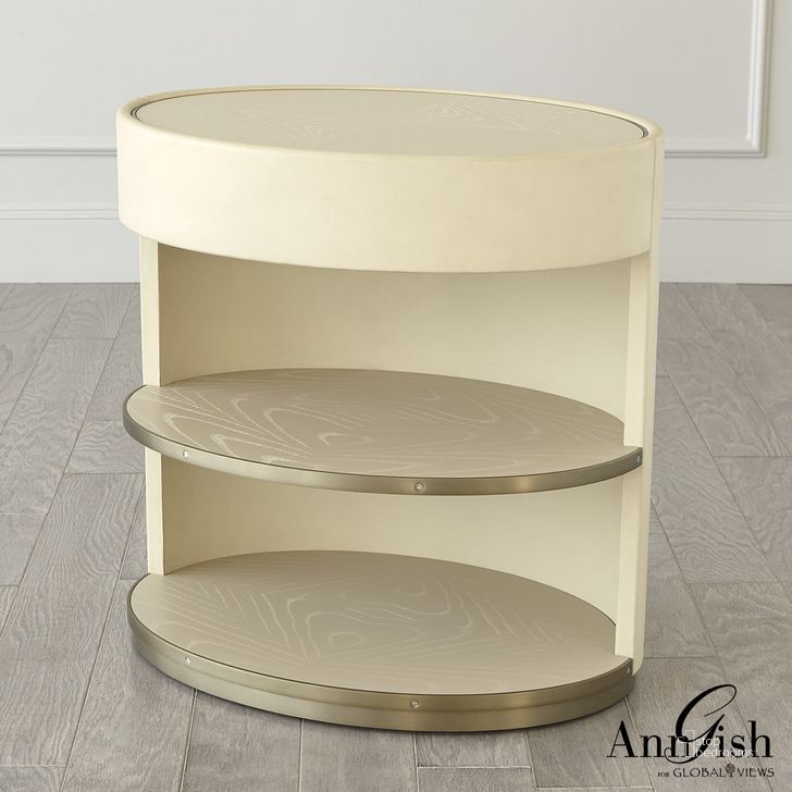 The appearance of Ellipse Bedside Cabinet In Ivory designed by Global Views in the modern / contemporary interior design. This silver piece of furniture  was selected by 1StopBedrooms from Ellipse Collection to add a touch of cosiness and style into your home. Sku: AG2.20029. Product Type: Chest. Material: Brass. Image1