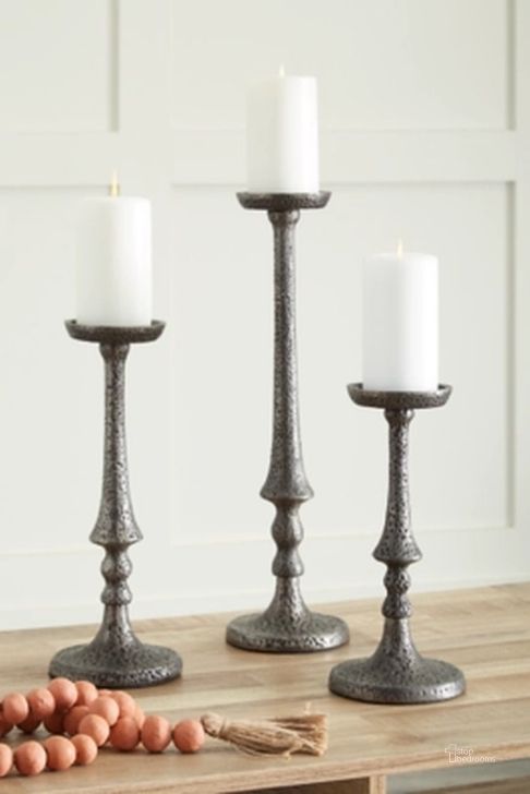 The appearance of Eravell Pewter Candle Holder Set of 3 designed by Signature Design by Ashley in the transitional interior design. This pewter piece of furniture  was selected by 1StopBedrooms from Eravell Collection to add a touch of cosiness and style into your home. Sku: A2000584. Material: Metal. Product Type: Candle Holder. Image1