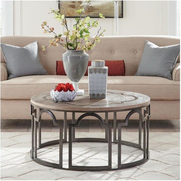 The appearance of Estelle Washed Gray Round Cocktail Table designed by Riverside Furniture in the industrial interior design. This brown and gray piece of furniture  was selected by 1StopBedrooms from Estelle Collection to add a touch of cosiness and style into your home. Sku: 20102. Product Type: Cocktail Table. Image1