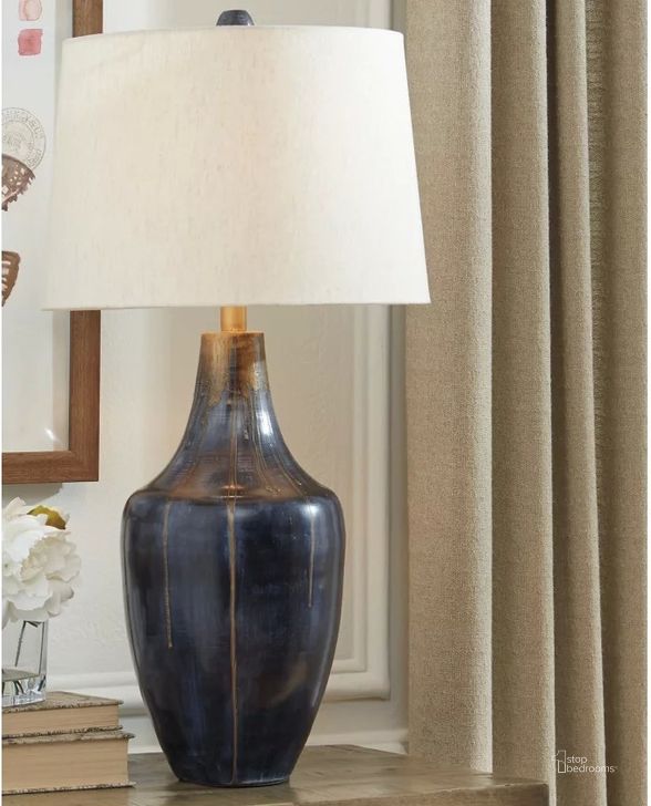 The appearance of Evania Indigo Metal Table Lamp designed by Signature Design by Ashley in the modern / contemporary interior design. This indigo piece of furniture  was selected by 1StopBedrooms from Evania Collection to add a touch of cosiness and style into your home. Sku: L207344. Product Type: Table Lamp. Image1