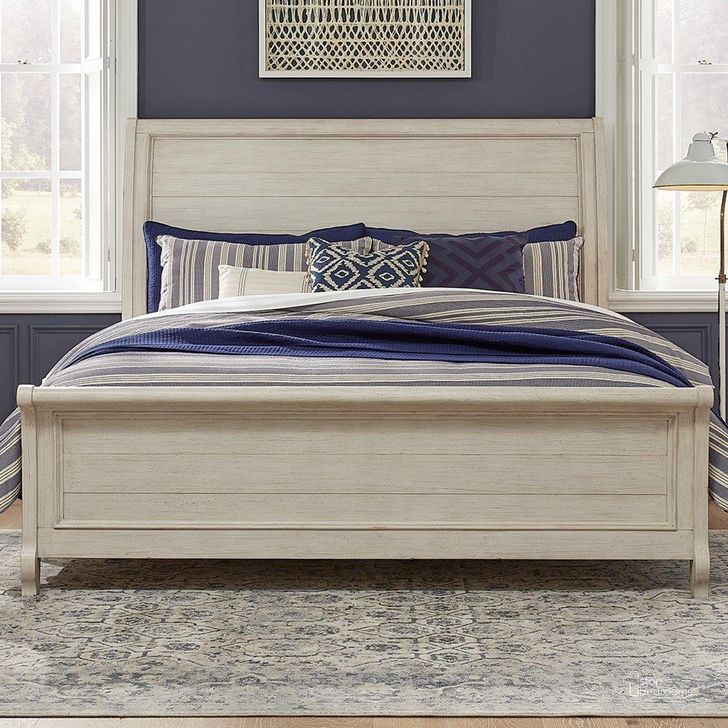 The appearance of Farmhouse Reimagined Antique White And Chestnut King Sleigh Bed designed by Liberty in the transitional interior design. This cream piece of furniture  was selected by 1StopBedrooms from Farmhouse Reimagined Collection to add a touch of cosiness and style into your home. Sku: 652-BR22H;652-BR22F;652-BR91. Bed Type: Sleigh Bed. Product Type: Sleigh Bed. Bed Size: King. Image1