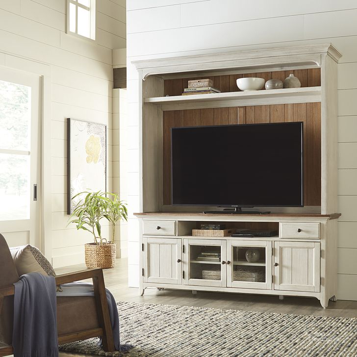 The appearance of Farmhouse Reimagined Opt Entertainment Center designed by Liberty in the country / farmhouse interior design. This antique white piece of furniture  was selected by 1StopBedrooms from Farmhouse Reimagined Collection to add a touch of cosiness and style into your home. Sku: 652-TV72;652-EC00. Product Type: Entertainment Center. Material: Wood Veneer. Image1