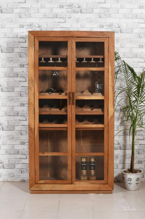The appearance of Fernious Tall Wine Cabinet In Natural designed by Moti in the rustic / southwestern interior design. This natural piece of furniture  was selected by 1StopBedrooms from Fernious Collection to add a touch of cosiness and style into your home. Sku: 93120001. Material: Wood. Product Type: Wine Cabinet. Image1