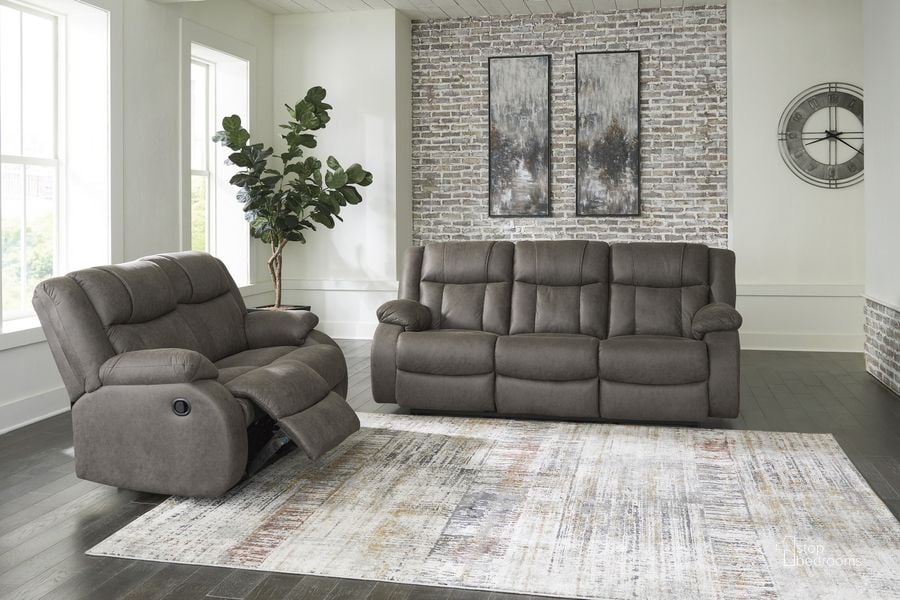 The appearance of First Base Reclining Living Room Set In Gunmetal designed by Signature Design by Ashley in the modern / contemporary interior design. This gunmetal piece of furniture  was selected by 1StopBedrooms from First Base Collection to add a touch of cosiness and style into your home. Sku: 6880488;6880486. Product Type: Living Room Set. Image1