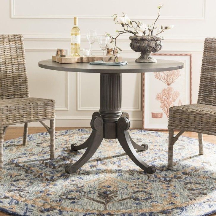 The appearance of Forest Gray Wash Drop Leaf Dining Room Set designed by Safavieh in the transitional interior design. This brown piece of furniture  was selected by 1StopBedrooms from Forest Collection to add a touch of cosiness and style into your home. Sku: DTB1000C;FOX6519A-SET2. Table Base Style: Pedestal. Table Top Shape: Round. Material: Wood. Product Type: Dining Room Set. Size: 43". Image1