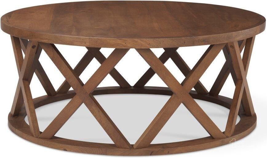 The appearance of Forsey Medium Brown Round Solid Wood Coffee Table designed by Mercana in the country / farmhouse interior design. This medium brown piece of furniture  was selected by 1StopBedrooms from Forsey Collection to add a touch of cosiness and style into your home. Sku: 69744. Material: Wood. Product Type: Coffee Table. Image1