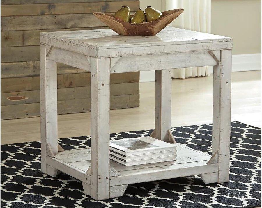 The appearance of Fregine White Wash Rectangular End Table designed by Signature Design by Ashley in the transitional interior design. This white wash piece of furniture  was selected by 1StopBedrooms from Fregine Collection to add a touch of cosiness and style into your home. Sku: T755-3. Material: Wood. Product Type: End Table. Image1