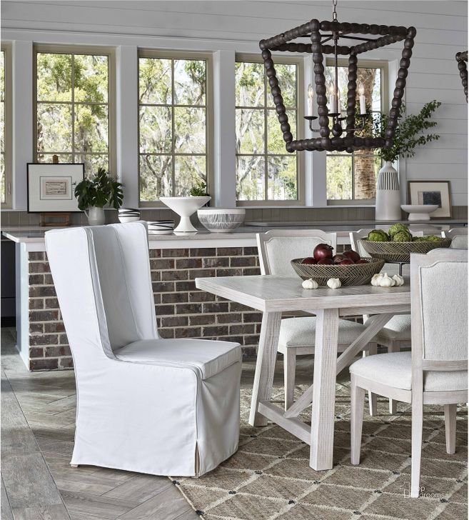 The appearance of Getaway Sea Oat Getaway Slip Cover Dining Chair designed by Universal in the transitional interior design. This sea piece of furniture  was selected by 1StopBedrooms from Getaway Collection to add a touch of cosiness and style into your home. Sku: U033638-RTA. Material: Fabric. Product Type: Dining Chair. Image1