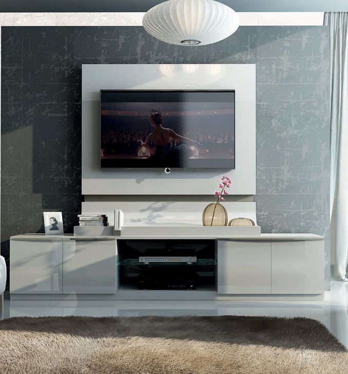 The appearance of Granada TV Panel designed by ESF in the modern / contemporary interior design. This white high gloss piece of furniture  was selected by 1StopBedrooms from Granada Collection to add a touch of cosiness and style into your home. Sku: GRANADATVPANEL. Material: MDF. Product Type: TV Stands and TV Console. Image1