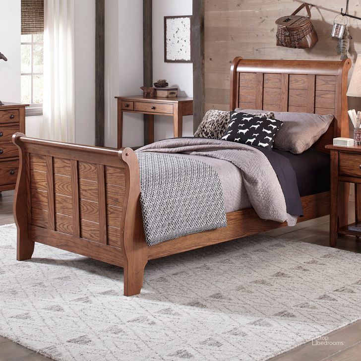 The appearance of Grandpa's Cabin Aged Oak Twin Sleigh Bed designed by Liberty in the rustic / southwestern interior design. This brown piece of furniture  was selected by 1StopBedrooms from Grandpas Collection to add a touch of cosiness and style into your home. Sku: 175-BR11HF;175-BR11R. Bed Type: Sleigh Bed. Material: Wood. Product Type: Sleigh Bed. Bed Size: Twin. Image1