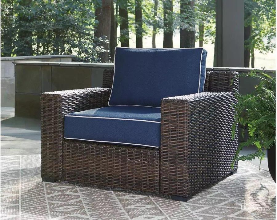 The appearance of Grasson Lane Brown And Blue Outdoor Lounge Chair With Cushion designed by Signature Design by Ashley in the transitional interior design. This brown/blue piece of furniture  was selected by 1StopBedrooms from Grasson Lane Collection to add a touch of cosiness and style into your home. Sku: P783-820. Material: Metal. Product Type: Outdoor Chair. Image1