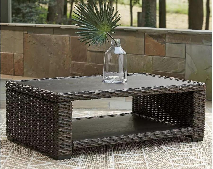 The appearance of Grasson Lane Brown Outdoor Rectangular Cocktail Table designed by Signature Design by Ashley in the transitional interior design. This brown piece of furniture  was selected by 1StopBedrooms from Grasson Lane Collection to add a touch of cosiness and style into your home. Sku: P783-701. Material: Metal. Product Type: Outdoor Table. Image1