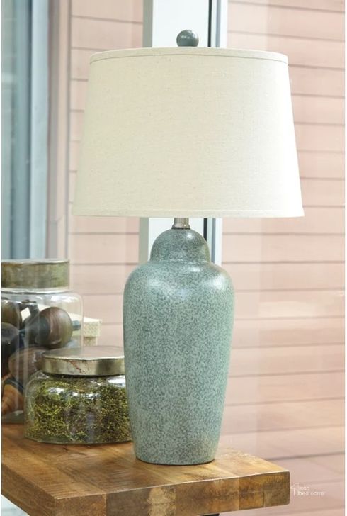 The appearance of Green Ceramic Table Lamp designed by Signature Design by Ashley in the modern / contemporary interior design. This green piece of furniture  was selected by 1StopBedrooms from Green Collection to add a touch of cosiness and style into your home. Sku: L100254. Material: Ceramic. Product Type: Table Lamp. Image1