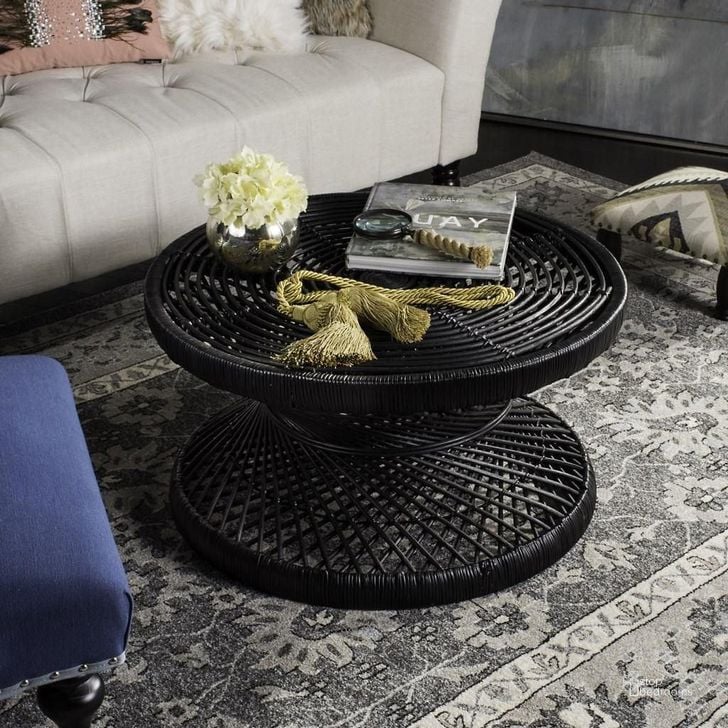 The appearance of Grimson Black Large Bowed Occasional Table Set designed by Safavieh in the transitional interior design. This black piece of furniture  was selected by 1StopBedrooms from Grimson Collection to add a touch of cosiness and style into your home. Sku: WIK6507A;WIK6506A. Material: Rattan. Product Type: Occasional Table Set. Image1