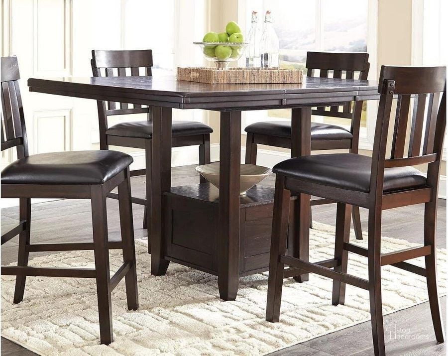 The appearance of Haddigan Dark Brown Rectangular Extendable Counter Height Dining Table designed by Signature Design by Ashley in the transitional interior design. This dark brown piece of furniture  was selected by 1StopBedrooms from Haddigan Collection to add a touch of cosiness and style into your home. Sku: D596-42. Material: Wood. Product Type: Counter Height Table. Table Top Shape: Rectangular. Image1