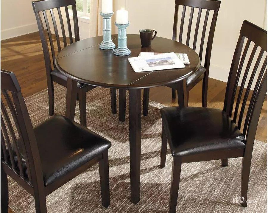 The appearance of Hammis Round Dining Room Drop Leaf Table designed by Signature Design by Ashley in the modern / contemporary interior design. This dark brown piece of furniture  was selected by 1StopBedrooms from Hammis Collection to add a touch of cosiness and style into your home. Sku: D310-15. Table Base Style: Legs. Table Top Shape: Round. Material: Wood. Product Type: Dining Table. Image1
