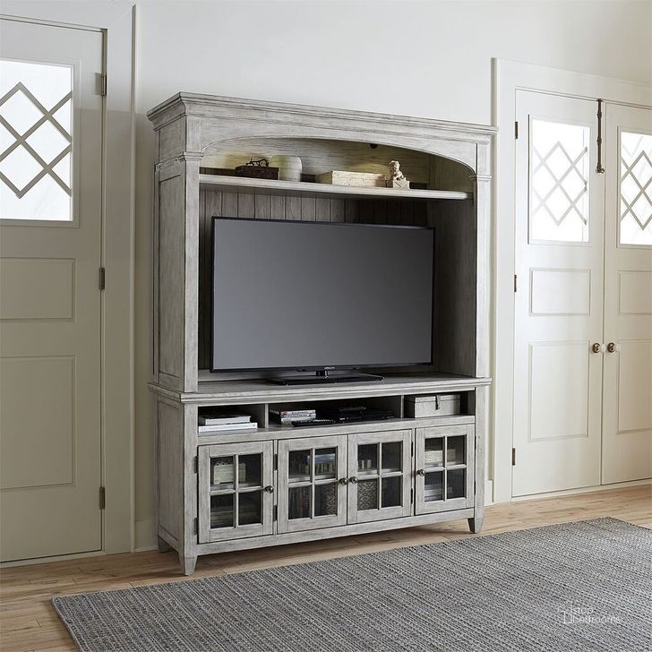 The appearance of Heartland Antique White Entertainment Center designed by Liberty in the country / farmhouse interior design. This off white piece of furniture  was selected by 1StopBedrooms from Heartland Collection to add a touch of cosiness and style into your home. Sku: 824-EC68;824-TV66. Product Type: Entertainment Centers and Wall. Material: Rubberwood. Image1