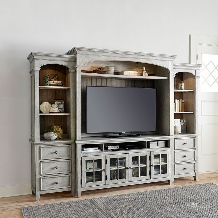 The appearance of Heartland Antique White Entertainment Wall Unit designed by Liberty in the country / farmhouse interior design. This off white piece of furniture  was selected by 1StopBedrooms from Heartland Collection to add a touch of cosiness and style into your home. Sku: 824-EC68;824-EL78;824-ER78;824-TV66. Product Type: Entertainment Centers and Wall. Material: Rubberwood. Image1