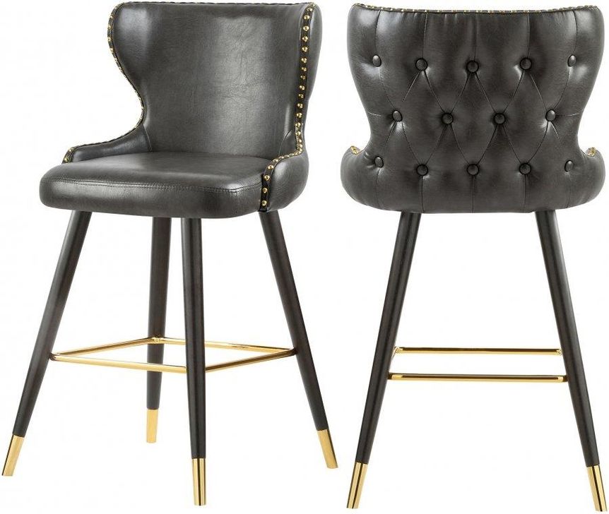 The appearance of Hendrix Grey Faux Leather Counter/Bar Stool Set of 2 designed by Meridian in the modern / contemporary interior design. This grey piece of furniture  was selected by 1StopBedrooms from Hendrix Collection to add a touch of cosiness and style into your home. Sku: 962Grey-C. Material: Faux Leather. Product Type: Barstool. Image1