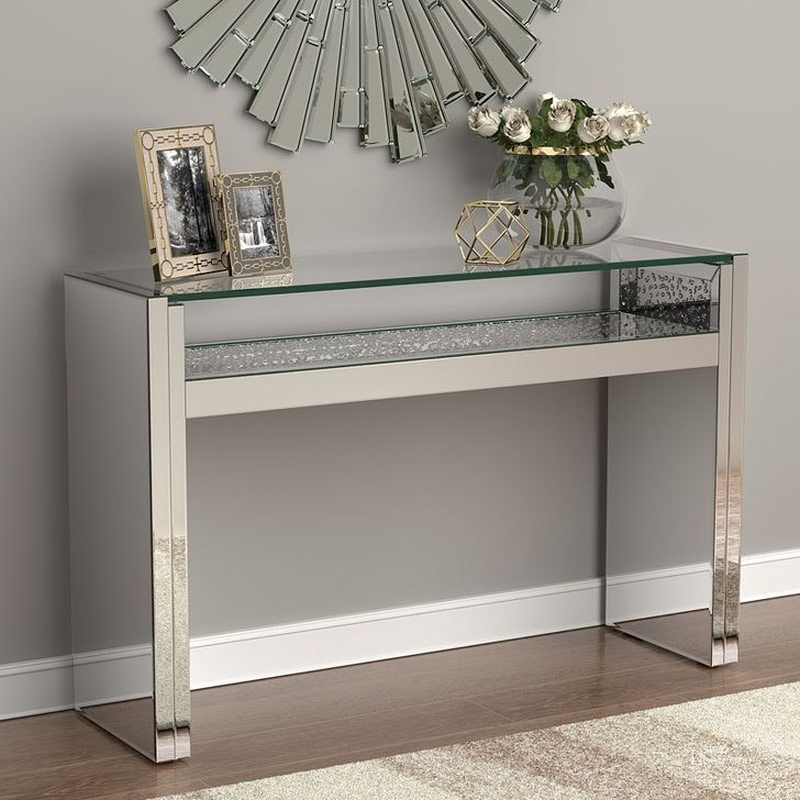 The appearance of Hollywood Glam Console Table w/ Floating Glass Top designed by Coaster in the modern / contemporary interior design. This silver piece of furniture  was selected by 1StopBedrooms from  to add a touch of cosiness and style into your home. Sku: 951766. Product Type: Sofa Table. Material: MDF. Image1