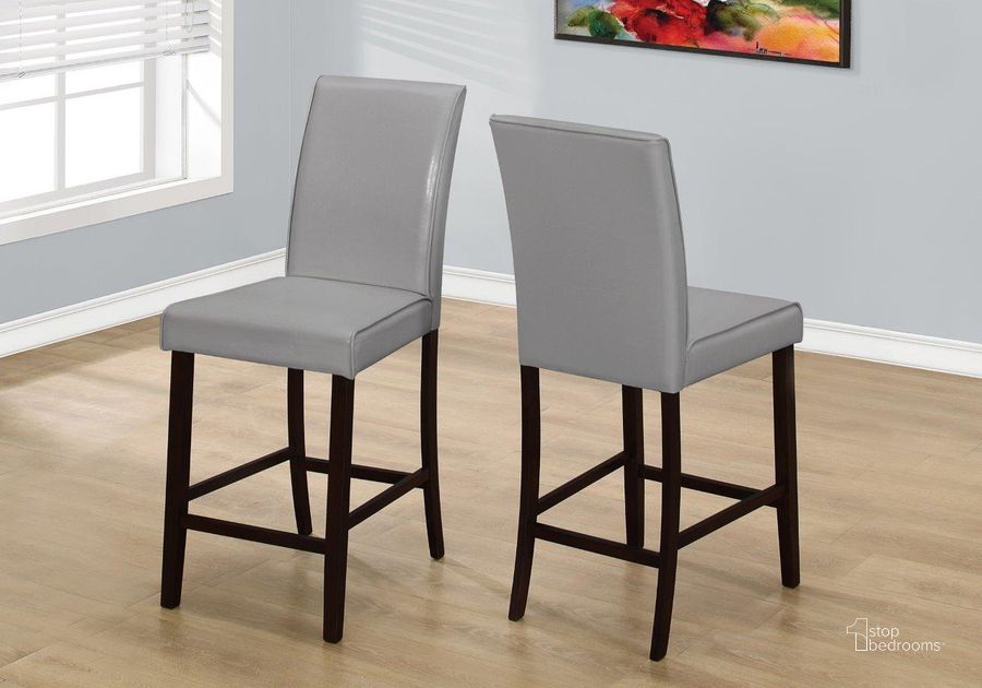 The appearance of Homeroots Two Grey Leather Look Solid Wood And Mdf Counter Height Dining Chairs designed by Homeroots in the glam interior design. This grey piece of furniture  was selected by 1StopBedrooms from  to add a touch of cosiness and style into your home. Sku: 332665. Material: Wood. Product Type: Dining Chair. Image1