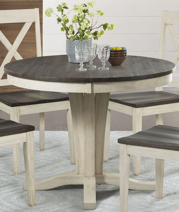 The appearance of Huron Distressed Chalk Cocoa Bean Extendable Round Dining Table designed by A-America in the transitional interior design. This white piece of furniture  was selected by 1StopBedrooms from Huron Collection to add a touch of cosiness and style into your home. Sku: HURCO610B;HURCO610T. Table Base Style: Pedestal. Table Top Shape: Round. Material: Wood. Product Type: Dining Table. Image1