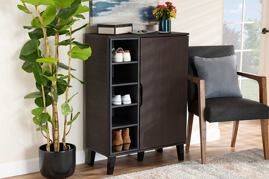 The appearance of Idina Mid-Century Modern Two-Tone Dark Brown and Grey Finished Wood 1-Door Shoe Cabinet designed by Baxton Studio in the transitional interior design. This dark brown piece of furniture  was selected by 1StopBedrooms from Idina Collection to add a touch of cosiness and style into your home. Sku: SESC16104-Modi Wenge-Shoe Cabinet. Material: Wood. Product Type: Shoe Cabinet. Image1