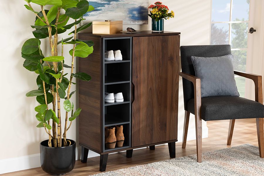 The appearance of Idina Mid-Century Modern Two-Tone Walnut Brown and Grey Finished Wood 1-Door Shoe Cabinet designed by Baxton Studio in the transitional interior design. This walnut piece of furniture  was selected by 1StopBedrooms from Idina Collection to add a touch of cosiness and style into your home. Sku: SESC16104-Columbia-Shoe Cabinet. Material: Wood. Product Type: Shoe Cabinet. Image1