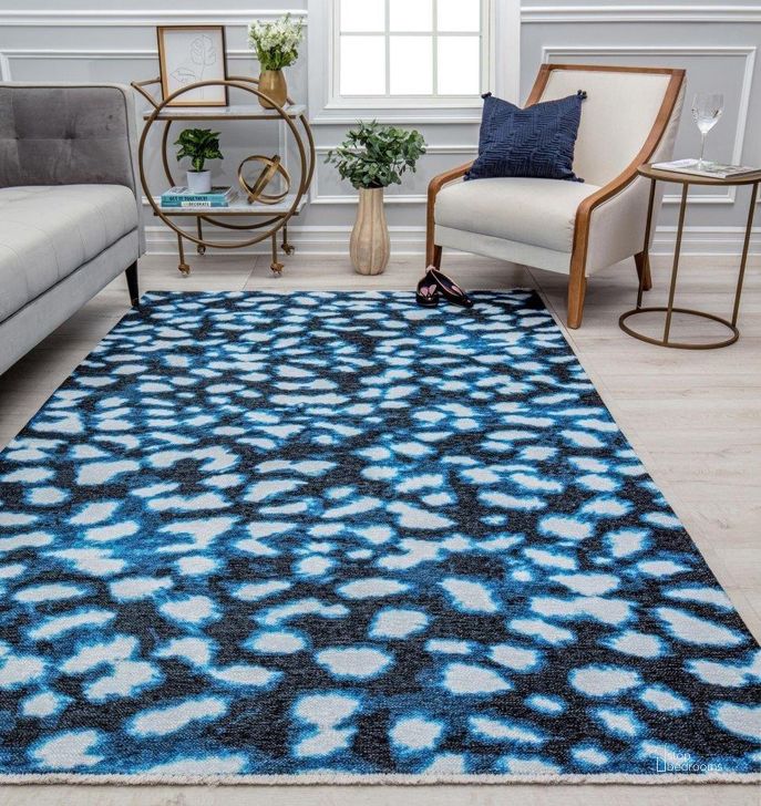 The appearance of Isaac Mizrahi Serafina EO35A Soft Spot Geometric Contemporary Blue 7'10 x 10' Area Rug designed by Rugs America in the modern / contemporary interior design. This dark blue piece of furniture  was selected by 1StopBedrooms from Serafina Collection to add a touch of cosiness and style into your home. Sku: RA31917. Material: Polyester. Product Type: Area Rugs. Image1