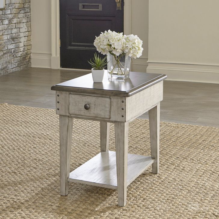 The appearance of Ivy Hollow Drawer Chair Side Table In Weathered Linen With Dusty Taupe Top designed by Liberty in the country / farmhouse interior design. This taupe piece of furniture  was selected by 1StopBedrooms from Ivy Hollow Collection to add a touch of cosiness and style into your home. Sku: 457-OT1021. Product Type: Chairside Table. Material: Poplar. Image1
