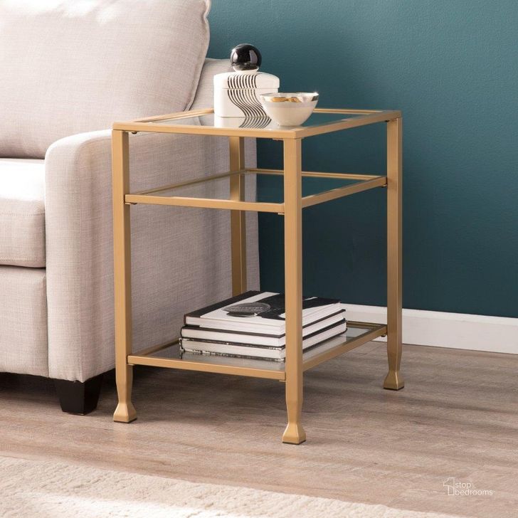 The appearance of Jaymes Gold Metal And Glass End Table designed by SEI Furniture in the transitional interior design. This gold piece of furniture  was selected by 1StopBedrooms from Jaymes Collection to add a touch of cosiness and style into your home. Sku: CK5772. Product Type: End Table. Material: Iron. Image1