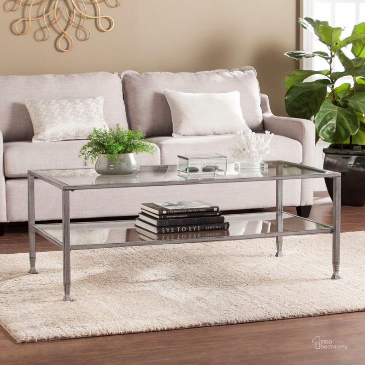 The appearance of Jaymes Metal And Glass Rectangular Open Shelf Cocktail Table designed by SEI Furniture in the modern / contemporary interior design. This silver piece of furniture  was selected by 1StopBedrooms from Jaymes Collection to add a touch of cosiness and style into your home. Sku: CK0779. Material: Glass. Product Type: Cocktail Table. Image1
