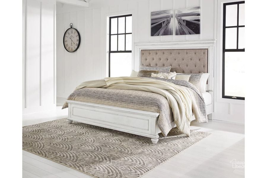 The appearance of Kanwyn King Panel Bed In White Wash designed by Signature Design by Ashley in the transitional interior design. This white wash piece of furniture  was selected by 1StopBedrooms from Kanwyn Collection to add a touch of cosiness and style into your home. Sku: B777-56;B777-97;B777-158. Bed Type: Panel Bed. Material: Wood. Product Type: Panel Bed. Bed Size: King. Image1