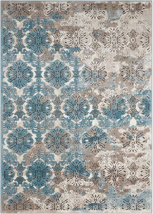 The appearance of Karma Ivory And Blue 9 X 13 Area Rug designed by Nourison in the transitional interior design. This ivory and blue piece of furniture  was selected by 1StopBedrooms from Karma Collection to add a touch of cosiness and style into your home. Sku: 99446339867. Material: Polypropylene. Product Type: Area Rugs. Image1