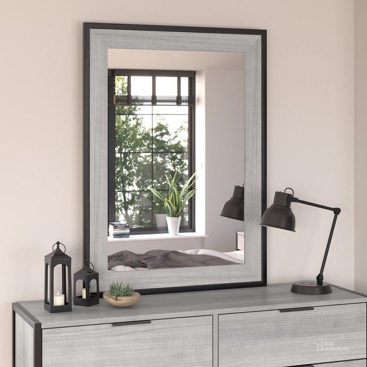 The appearance of Kathy Ireland Home By Bush Furniture Atria Bedroom Mirror In Platinum Gray designed by Bush Furniture in the industrial interior design. This gray piece of furniture  was selected by 1StopBedrooms from Atria Collection to add a touch of cosiness and style into your home. Sku: ARA130PG. Material: Wood. Product Type: Mirror. Image1